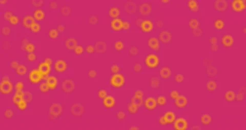 Abstract blurry circle particles flying on pink background. 4K rendered motio 스톡 동영상 213940108