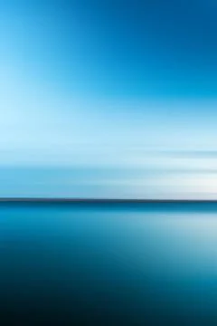 Abstract blurry dramatic Sunset in Long Exposure for background Stock Photos