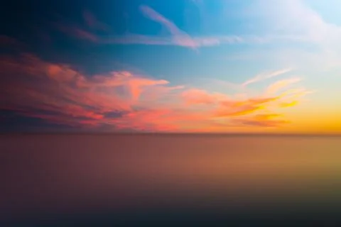 Abstract blurry dramatic Sunset in Long Exposure for background Stock Photos