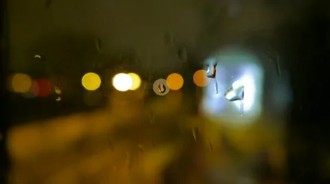 Abstract blurs of lights and rain drops through the window Vídeo Stock 49593078