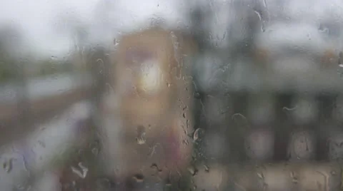 Abstract blurs of lights and rain drops through the window Stock Footage 49606391