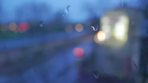 Abstract blurs of lights and rain drops through the window Stock Footage 49606449