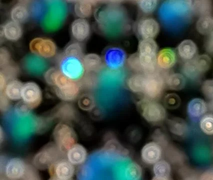 Abstract bokeh background with blurred strings of assorted coloured lights Stock Photos