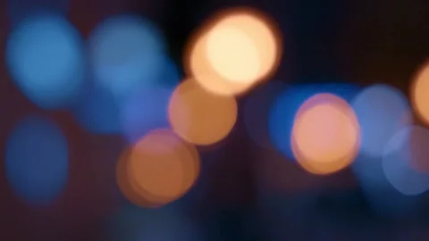 Abstract Bokeh Background of Blurry Blue and Orange Lights at Night Stock Footage 299241012