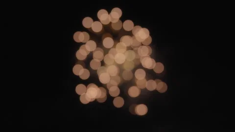 Abstract bokeh background of exploding orange fireworks on a dark night sky Stock Footage 319815472