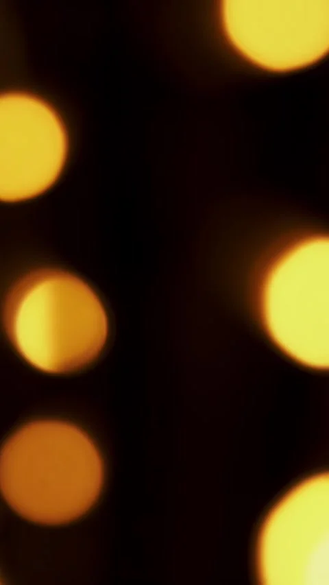Abstract bokeh background in motion. shining, blurred golden particles, lights. Stock Footage 321615778
