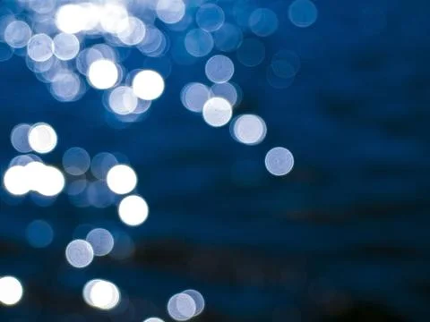 Abstract bokeh background side white glare on the water Stock Photos
