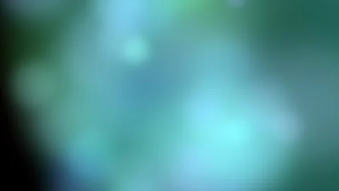Abstract bokeh background transitions from muted to vibrant colors Stock Footage 325768902