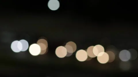 Abstract bokeh light background with blurred glowing circular shapes against Stock Footage 325298811