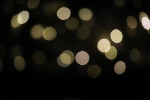 Abstract Bokeh Light Background with Soft Circular Orbs and Dark Blur Effect Stock Photos