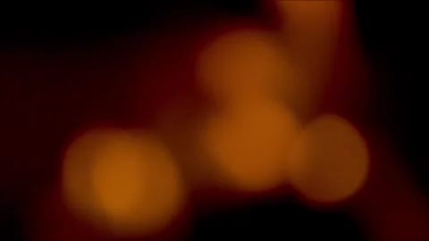 Abstract bokeh light blur in motion. Soft glowing orbs creating warm ambient atm Видео 340450182