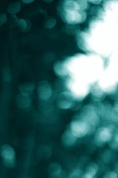 Abstract Bokeh Light Effects with a Teal Color Palette for Serene Visuals Foto stock