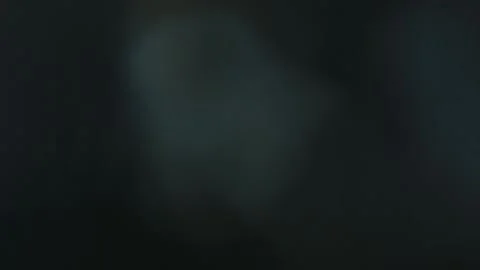 Abstract bokeh light leaks on a black background Stock Footage 160834075