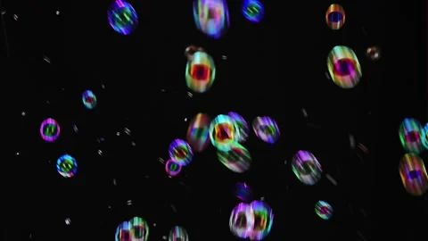 Abstract bokeh light orbs floating in darkness. Colorful glowing spheres with le Видео 340450271