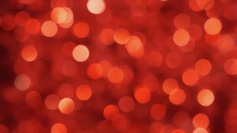 Abstract bokeh light particles in motion. Dynamic red glowing dots background an 스톡 동영상 340456723
