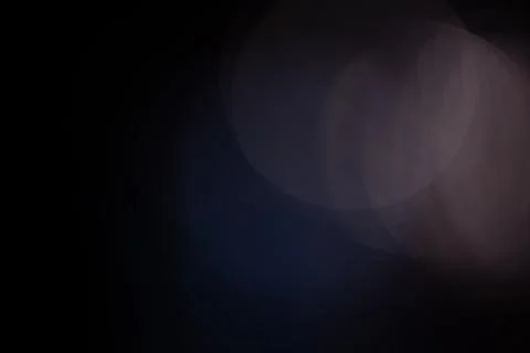 Abstract bokeh light texture with dark background overlay Stock Photos