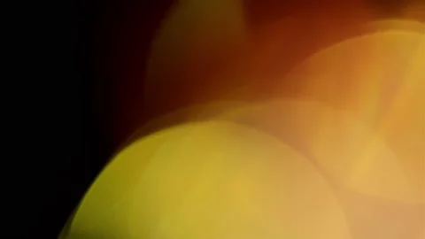 Abstract bokeh lights against black background. Golden lights. Stock Footage 151380907