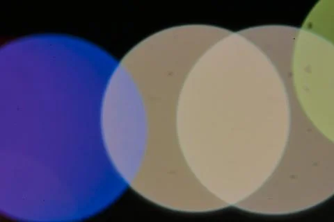 Abstract Bokeh Lights Background with Circular Shapes in Blue, Beige and Gree Stock Photos