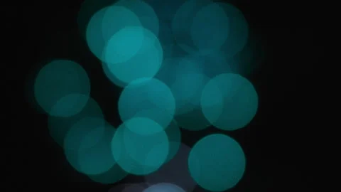 Abstract bokeh lights background of exploding blue fireworks in the sky Video stock 319813326