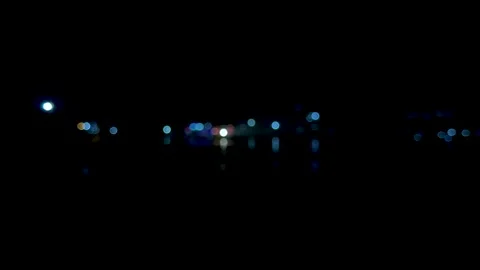 Abstract bokeh lights in a dark night scene with vibrant colors and soft fo.. Stock Footage 340219741