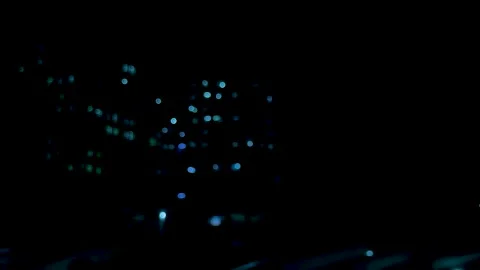 Abstract bokeh lights in deep blue and black creating a mysterious and ench.. Stock Footage 340219785