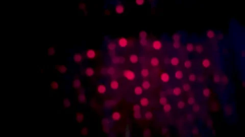 Abstract bokeh lights in deep red and purple hues creating a mysterious and.. Stock Footage 340052508