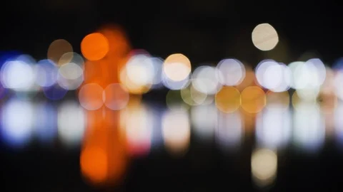Abstract bokeh lights forming from lit up buildings glistening over lake, hanoi Stock Footage 147366739