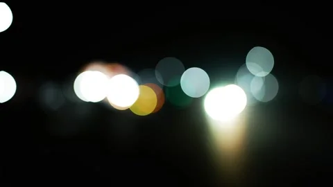 Abstract Bokeh Lights at Night, Abstract bokeh lights in various colors aga.. Stock Footage 304911207