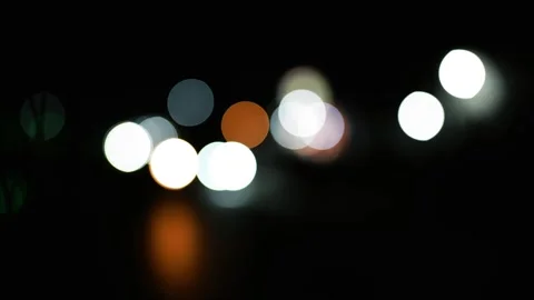 Abstract Bokeh Lights at Night, Abstract bokeh lights in various colors aga.. Видео 304911260