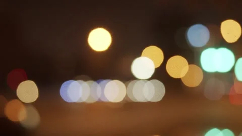 Abstract Bokeh Lights at Night with Warm Colors and Blue Accents 库存影片 334639456