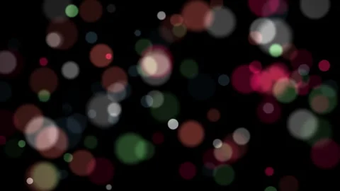 Abstract bokeh lights with soft focus on a dark background, creating a festive Stock Footage 344241343
