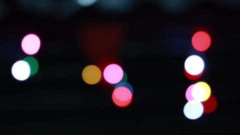 Abstract Bokeh Lights in Various Colors on a Dark Background Stock Footage 306584331