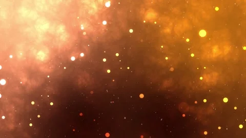 Abstract bokeh particles float slowly in the air on an orange background. 動画素材 293472371