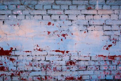 Abstract Brickwall Background Texture. Old brick wall painted blue with peeli Stock Photos