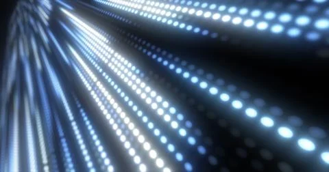 Abstract bright blue background pattern of flying circles of dots and glowing Stock Photos