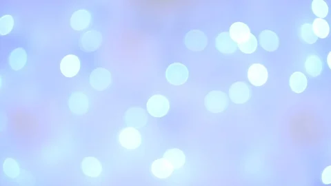 Abstract bright blue bokeh lights on smooth defocused purple background Vídeos de archivo 100229548
