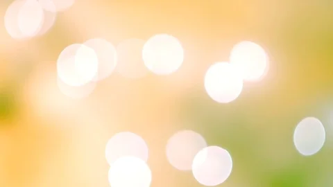 Abstract bright bokeh lights on smooth defocused green and yellow background 스톡 동영상 100229575