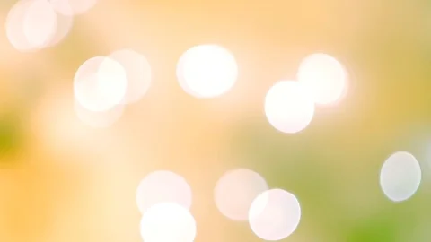 Abstract bright bokeh lights on smooth defocused green and yellow background Vídeos de archivo 100229584