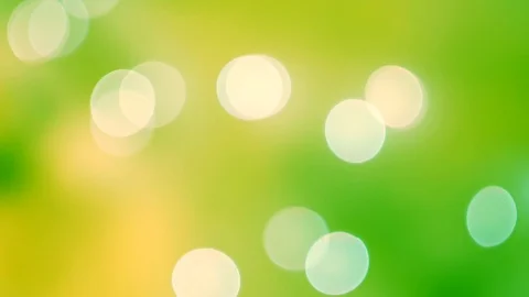 Abstract bright bokeh lights on smooth defocused green and yellow background Vídeos de archivo 100229666