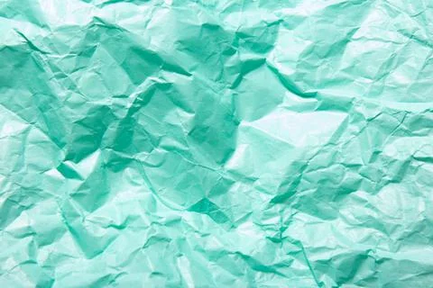 Abstract bright green background. Squeezed craft paper Stock Photos