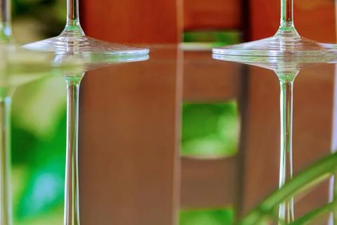 Abstract bright vivid background. Close-up view of wine glasses, elegant stems Stock Photos