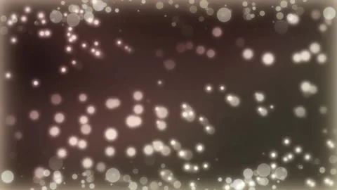 Abstract brown background featuring floating glowing particles moving through Stock Footage 345329656