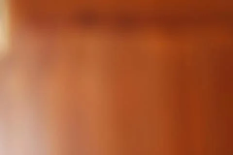 Abstract brown background with soft blurred texture and warm gradient lightin Stock Photos