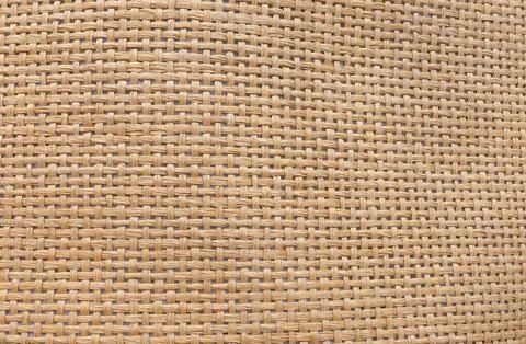 Abstract brown straw hat texture. Texture of straw hat from natural fibers. Stock Photos