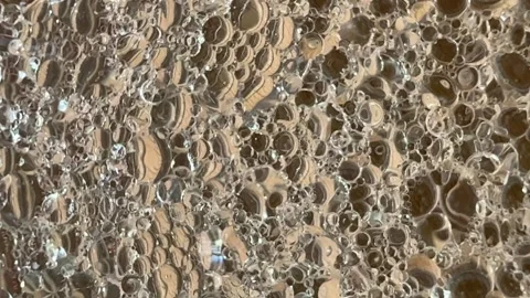 Abstract bubbles popping and bubbling mixture of oil and water background Stock Footage 240733474