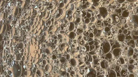 Abstract bubbles popping and bubbling mixture of oil and water background Stock Footage 240733576