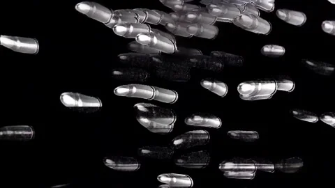 Abstract Bullets Transforming and Glitching on Black Background Stock Footage 309843069