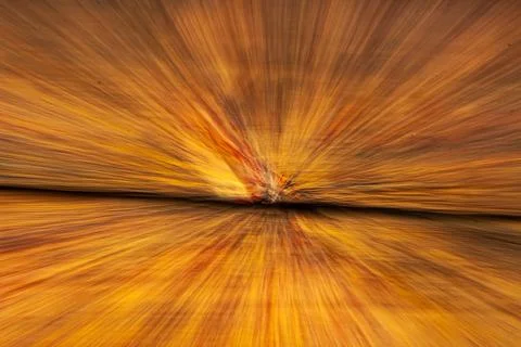 An abstract burst of golden light in dramatic motion. Stock Photos