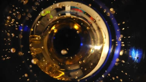 Abstract camera eye background from a glass of champagne Stock Footage 294760861
