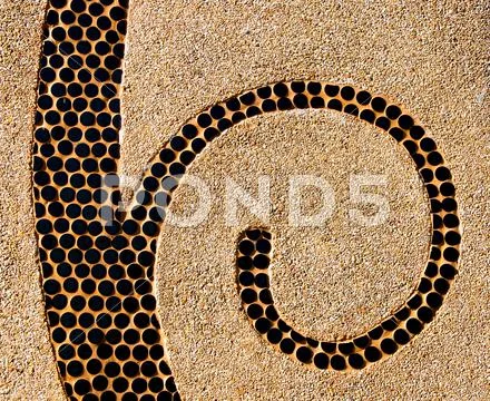 The abstract ceramic spiral on pebble background Stock Illustration